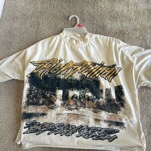 Cream Graphic T-Shirt with Black and Gold Design